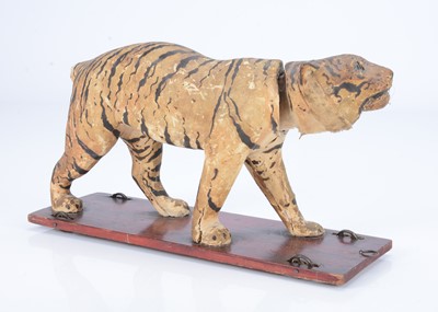 Lot 29 - An 19th century skin covered nodding tiger on wheels