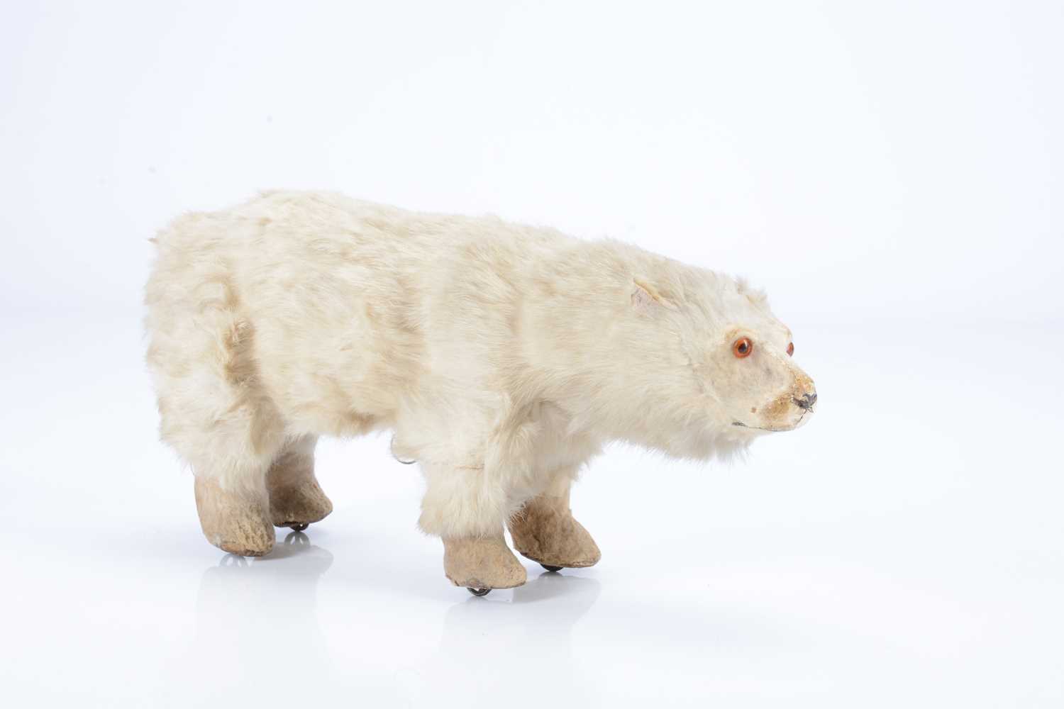 Lot 30 - A late 19th century fur polar bear on wheels