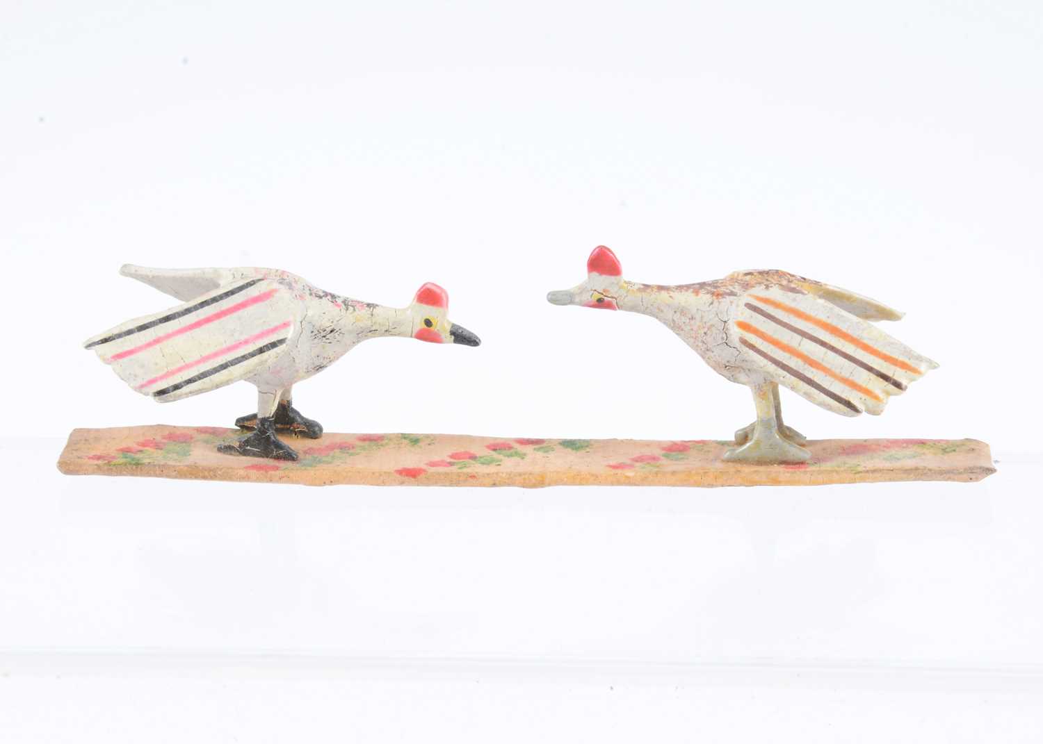 Lot 35 - A late 19th century Erzgebirge wooden pair of fighting cocks