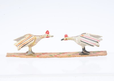 Lot 35 - A late 19th century Erzgebirge wooden pair of fighting cocks
