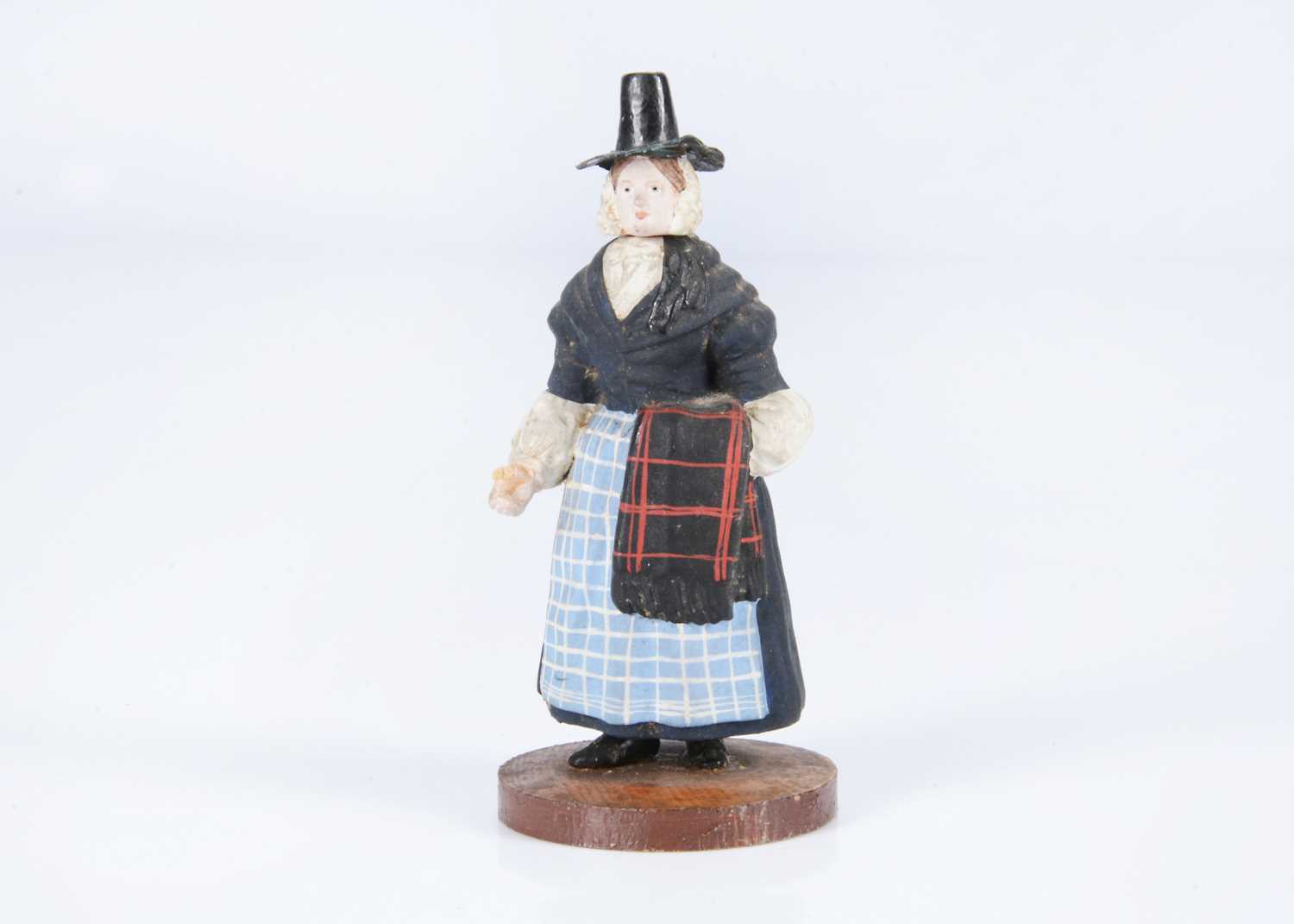 Lot 41 - An 19th century German composition figure of a Welsh woman container