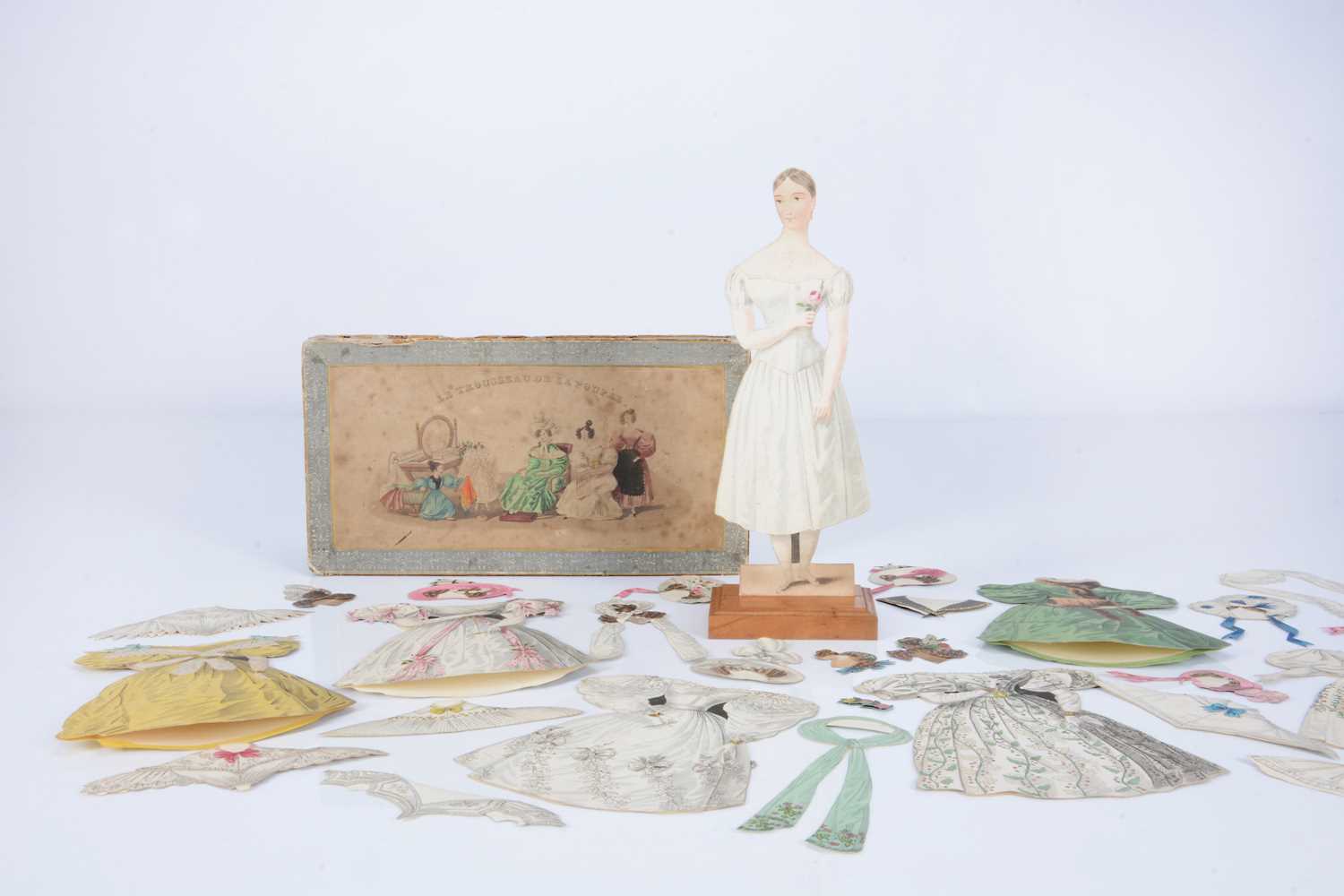 Lot 50 - A rare 1830s French paper doll ‘Le Trousseau de la Poupée’