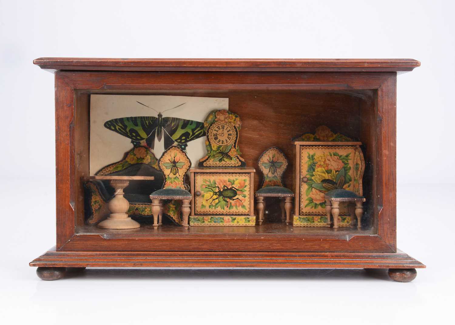 Lot 55 - A late 19th century German chromolithographic paper covered dolls’ house set with insects