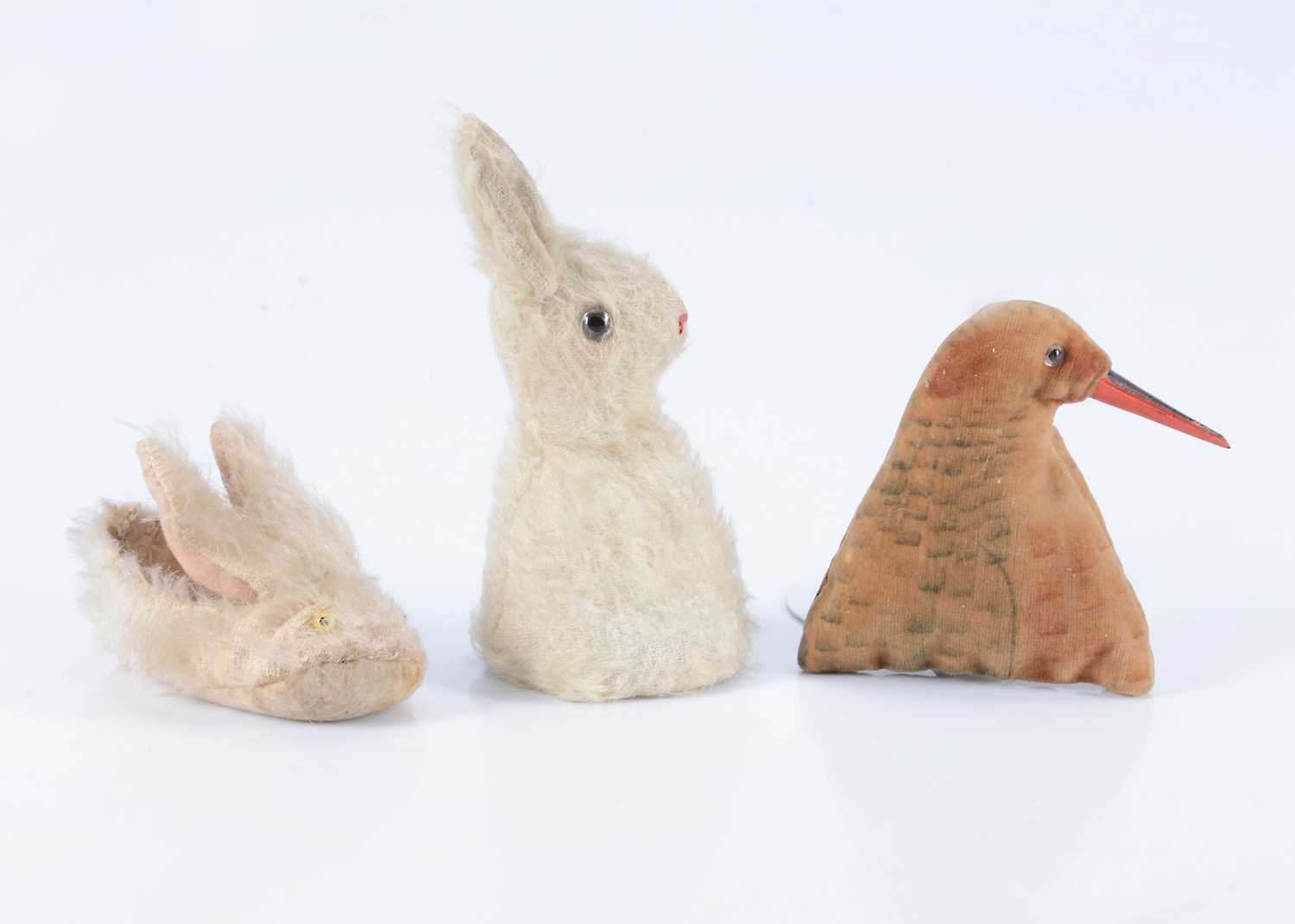 Lot 61 - An English white rabbit egg cosy, 1915/20s
