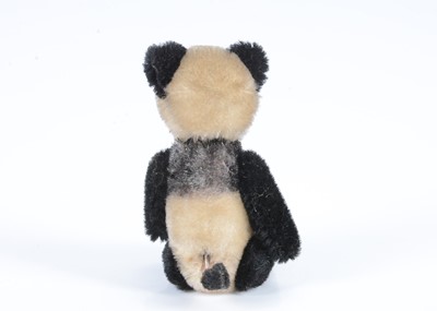 Lot 74 - A small post-war Schuco yes/no panda bear