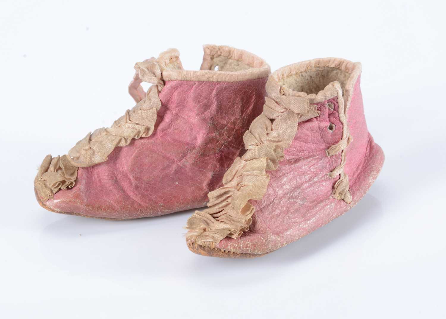 Lot 95 - A rare pair of early 19th century pink kid dolls’ half-boots