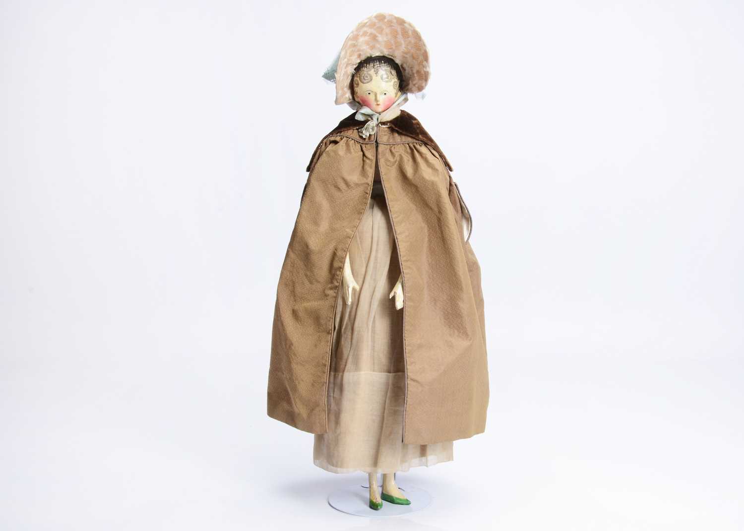 Lot 104 - A fine and large 19th century Grodnertal carved wooden doll with comb tuck