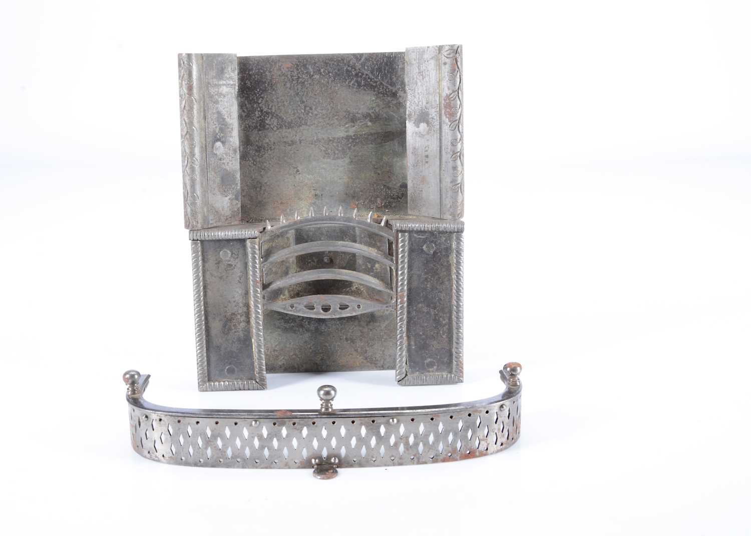 Lot 105 - An early 19th or possibly 18th century dolls’ house steel fireplace and fender