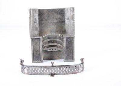 Lot 105 - An early 19th or possibly 18th century dolls’ house steel fireplace and fender
