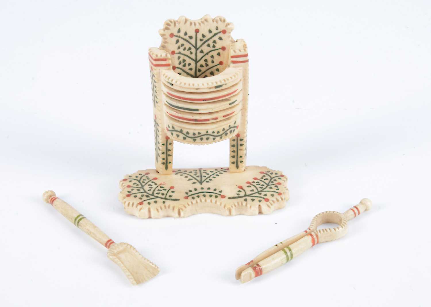 Lot 107 - An 19th century bone Prisoner of War dolls’ house fireplace and irons