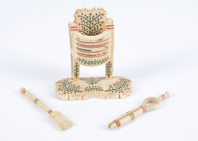 Lot 107 - An 19th century bone Prisoner of War dolls’ house fireplace and irons