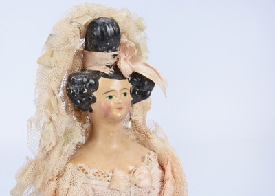 Lot 108 - A fine German papier-mâché shoulder-head doll with Apollo-knot hairstyle, 1830s