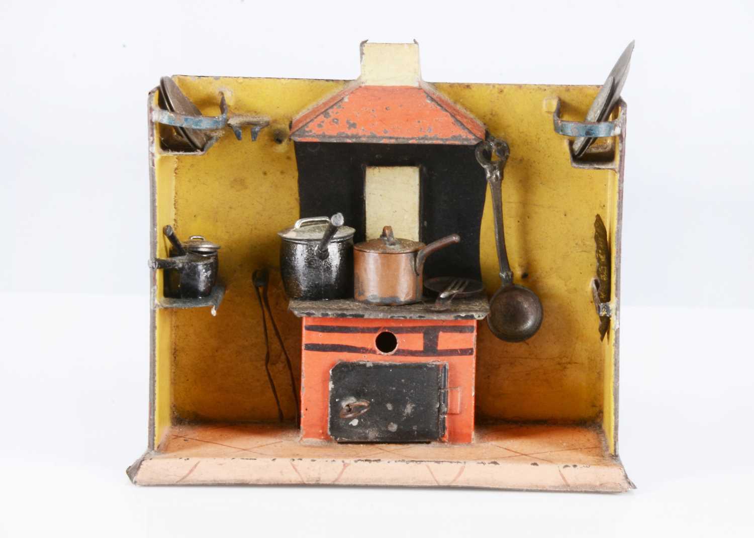 Lot 111 - An 19th century small German painted tinplate toy kitchen