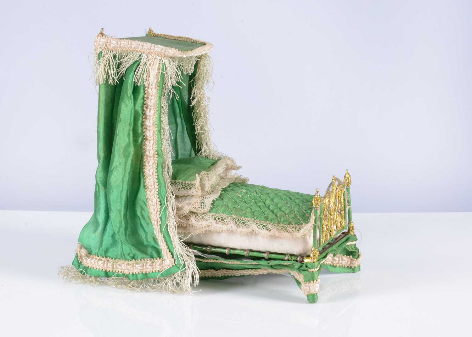 Lot 116 - A fine 19th century soft metal dolls’ house half-tester bed
