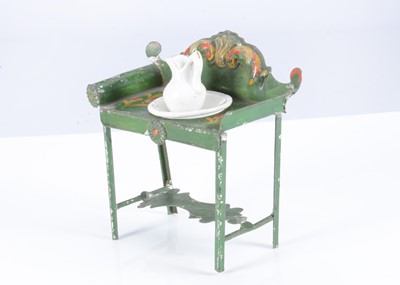 Lot 117 - A rare early 19th century Evans & Cartwright green painted tinplate dolls’ house washstand