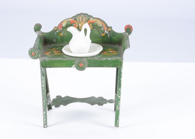 Lot 117 - A rare early 19th century Evans & Cartwright green painted tinplate dolls’ house washstand