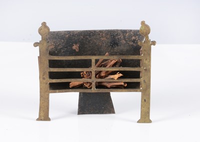 Lot 122 - An early English brass dolls’ house fire grate