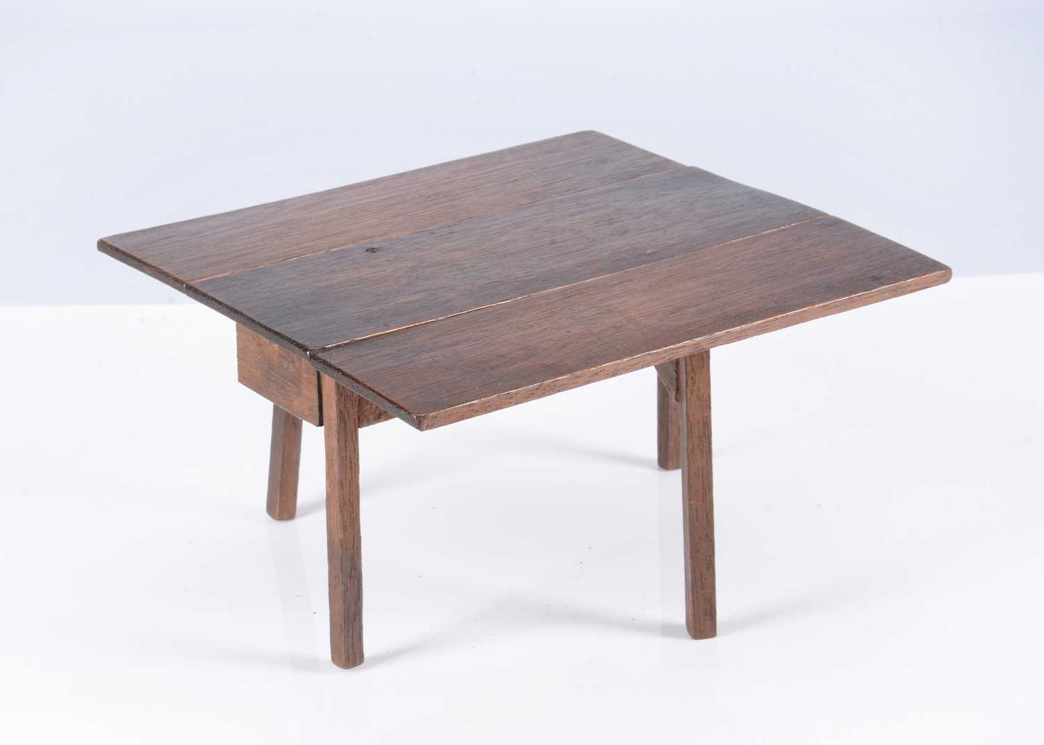 Lot 125 - A rare early 19th century John Bubb oak dolls’ house drop leaf dining table
