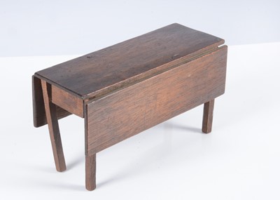Lot 125 - A rare early 19th century John Bubb oak dolls’ house drop leaf dining table