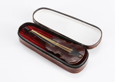 Lot 127 - An 19th century doll’s or dolls’ house violin and case sweet box (candy container)