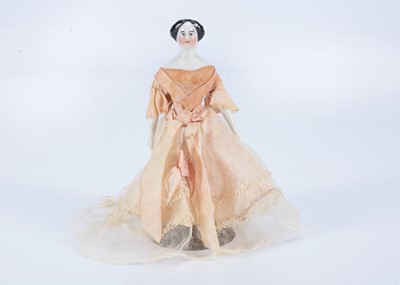 Lot 128 - An 19th century German large scale dolls’ house china shoulder head doll