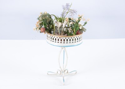 Lot 129 - An early 20th century German painted tinplate dolls’ house plant stand