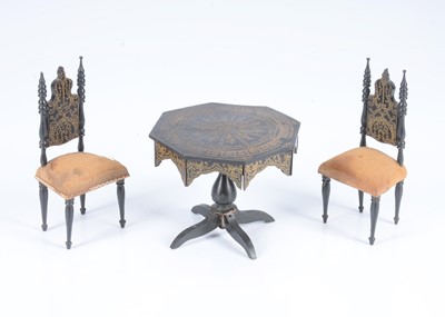 Lot 132 - A late 19th century Waltershausen ebonised gothic dolls’ house table and chairs