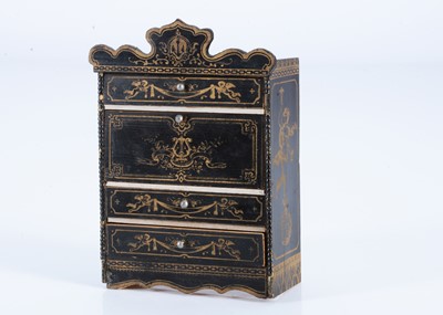 Lot 135 - A late 19th century Waltershausen ebonised dolls’ house drop front bureau