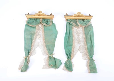 Lot 136 - A pair of 19th century gilt wooden dolls’ house pelmets and curtains