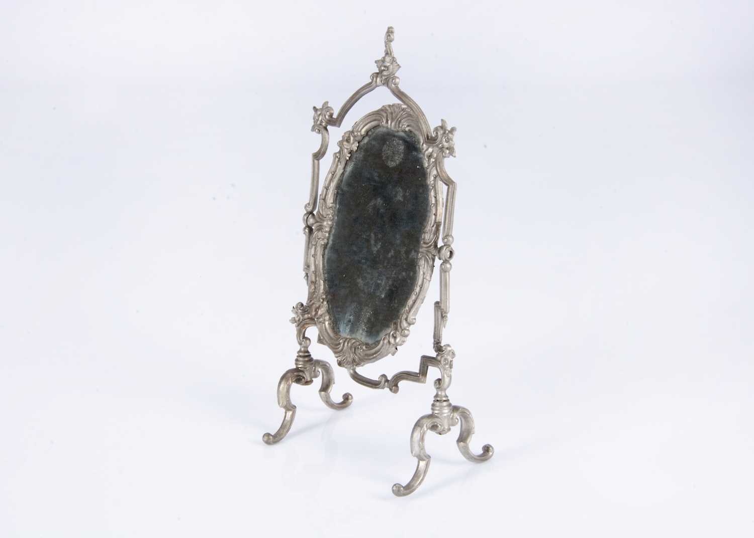 Lot 149 - An 19th century German soft metal doll’s or large dolls’ house cheval mirror