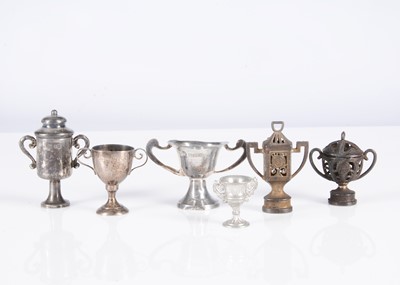 Lot 163 - Six dolls’ house trophies