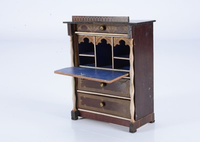 Lot 170 - An 19th century Waltershausen larger scale dolls’ house drop front bureau
