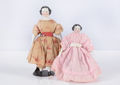 Lot 180 - Two 19th century German china shoulder-head dolls’ house dolls