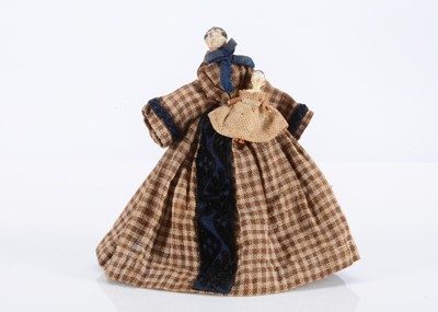 Lot 184 - An 19th century Grodnertal wooden dolls’ house mother and baby doll