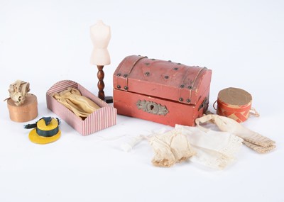 Lot 204 - A late 19th century dolls’ house red leather trunk