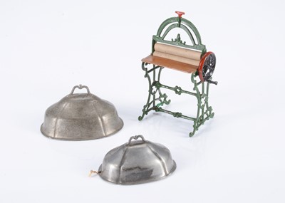 Lot 215 - Two 19th century German pewter dolls’ house meat covers