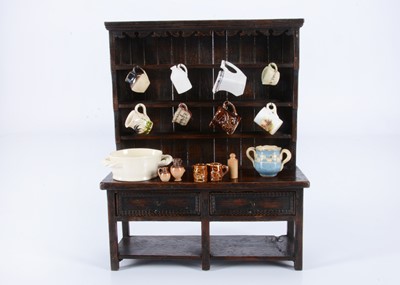 Lot 220 - A well made early 20th century miniature or large scale doll’s house oak dresser