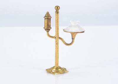 Lot 236 - A late 19th century German gilt metal dolls’ house student lamp