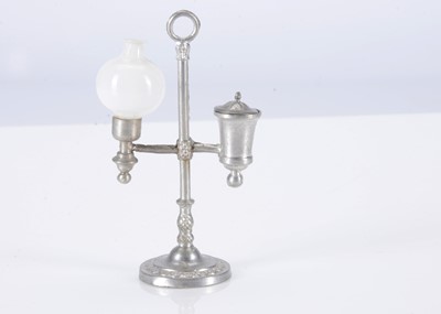 Lot 237 - A late 19th century German pewter dolls’ house student lamp