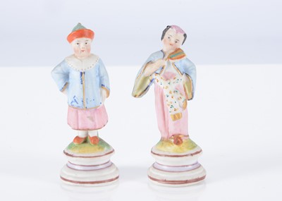 Lot 243 - A pair of late 19th century bisque dolls’ house figures of an Asian couple