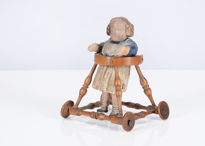 Lot 251 - A rare mid 19th century German composition child in wooden walker