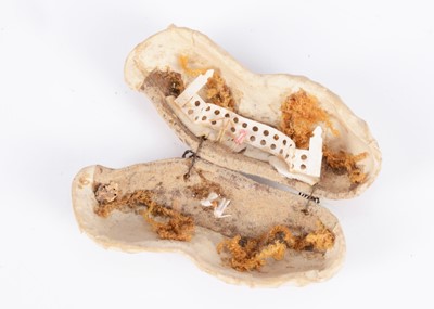 Lot 267 - An 19th century peanut shell with paper scene