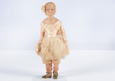 Lot 269 - An early 19th century small English poured wax child doll