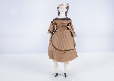 Lot 272 - A rare German bisque shoulder-head doll with moulded hat