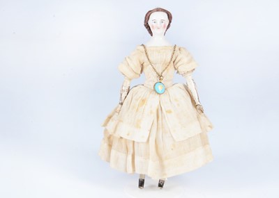 Lot 273 - An 19th century German wigged china shoulder head doll