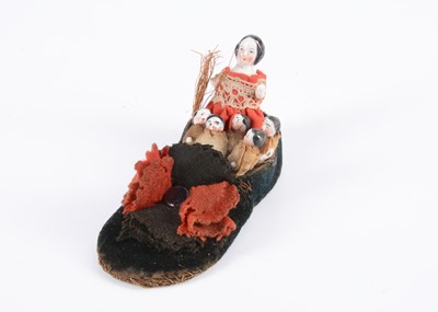 Lot 281 - An 19th century Frozen Charlotte ‘there was an old lady who lived in a shoe’