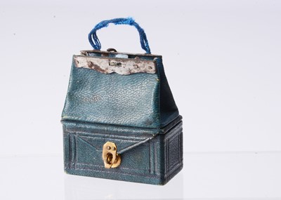Lot 286 - An 19th century French fashion doll’s leather traveling bag and nécessaire