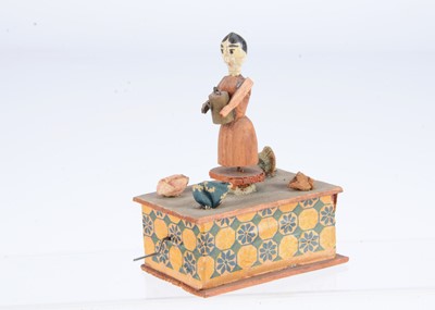 Lot 303 - An early 20th century Erzgebirge wooden vegetable gardener crank toy