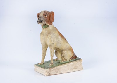 Lot 304 - An 19th century German papier-mâché seated hound squeak toy