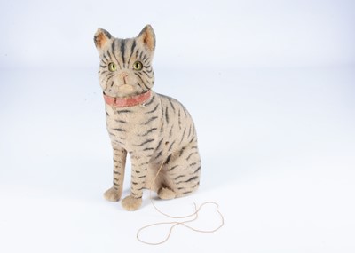 Lot 308 - A late 19th century German plush covered composition tabby cat miaow toy
